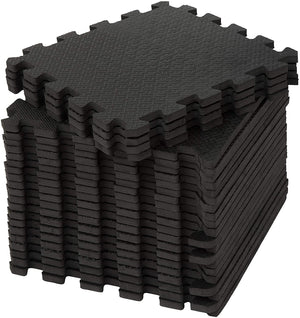 Stacked small black foam mat tiles from the Small Interlocking Mat Tiles in Black - Pack of 24