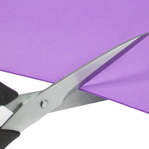 Scissors cutting a purple EVA foam sheet