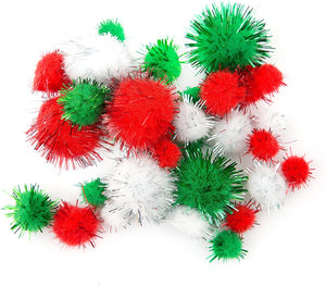 Close up of glitter green, white and red pom poms from the Mini Christmas Craft Kit