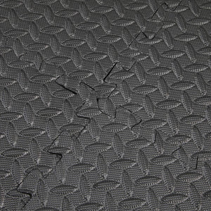 Close up of the textured flooring of the Extra Large Interlocking Black Foam Mat Tiles - Pack of 12